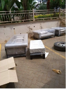 grey plastic wrapped couches